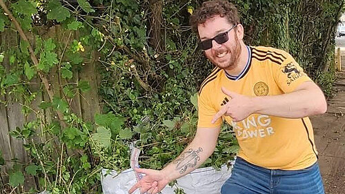 Alex Lock pointing at cleaned up mess